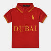 Child wearing a red polo shirt with 'Dubai' printed on it against a plain background