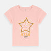 Child wearing a pink t-shirt with a star design on a white background
