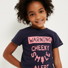 Child wearing a navy blue t-shirt with pink text on a white background