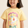 Child wearing a yellow t-shirt with a colorful design and text, standing against a plain background.