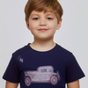 Child wearing a navy blue t-shirt with a vintage car design on a plain background