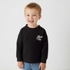 Child wearing a black sweatshirt with text on a white background