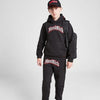 Person wearing a black 'Hood Rich' hoodie and pants with a red logo on a white background