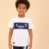 Child wearing a white t-shirt with '4 France' printed on it against a beige background