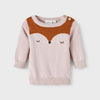 Baby wearing a pink sweater with a fox design on a white background