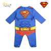 Child wearing a Superman costume on a white background