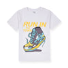 Child wearing a white t-shirt with a colorful shoe graphic and text on a beige background