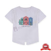 Child wearing a white t-shirt with colorful house design on a yellow background